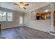 Open-concept living room with hardwood flooring, neutral paint, and natural light from an exterior door at 3505 Gum Creek Rd, Oxford, GA 30054
