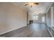Large living room features hardwood floors, neutral paint, and access to kitchen and dining area at 3505 Gum Creek Rd, Oxford, GA 30054