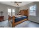 The main bedroom has hardwood floors, a ceiling fan, natural light, and a view of the back yard at 3505 Gum Creek Rd, Oxford, GA 30054