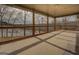 Back porch featuring wood beams and a great view of the adjacent lake at 3505 Gum Creek Rd, Oxford, GA 30054