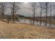 Scenic view of a serene pond surrounded by trees, perfect for a tranquil escape at 3505 Gum Creek Rd, Oxford, GA 30054