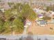 An aerial view of single-story homes nestled among trees in a quiet residential neighborhood at 210 Imad Ct, Fairburn, GA 30213