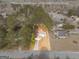 An aerial view shows the property lines of the single-story home and landscaped lot at 210 Imad Ct, Fairburn, GA 30213