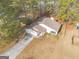 Aerial view showcasing the home's curb appeal and long driveway at 210 Imad Ct, Fairburn, GA 30213