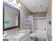 Neutral bathroom offers granite vanity, framed mirror, and shower-tub combination at 210 Imad Ct, Fairburn, GA 30213