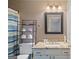 Bathroom features granite vanity, framed mirror, and shower-tub combination at 210 Imad Ct, Fairburn, GA 30213