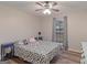 Comfortable bedroom features natural light and a ceiling fan at 210 Imad Ct, Fairburn, GA 30213