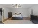 Spacious bedroom features a ceiling fan, wood floors, and walk-in closet at 210 Imad Ct, Fairburn, GA 30213