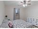 Bright bedroom features natural light and a ceiling fan at 210 Imad Ct, Fairburn, GA 30213