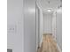 Hallway with white trim, neutral walls, and wood floors at 210 Imad Ct, Fairburn, GA 30213