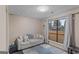 Cozy living room with a comfortable sofa and view to the outside at 210 Imad Ct, Fairburn, GA 30213