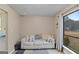 Cozy living room with a comfortable sofa and view to the outside at 210 Imad Ct, Fairburn, GA 30213