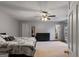 Bright main bedroom featuring a ceiling fan, dresser and ensuite at 210 Imad Ct, Fairburn, GA 30213