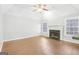 Spacious living room with hardwood floors and fireplace at 9361 Sweetbriar Cir, Jonesboro, GA 30236