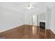 Main bedroom with hardwood floors and fireplace at 9361 Sweetbriar Cir, Jonesboro, GA 30236