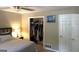 Well-lit bedroom with a spacious closet at 9285 Cedar Ridge Nw Dr, Covington, GA 30014