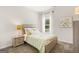 Cozy bedroom with a light green comforter and a wood-framed bed at 10462 Trellis Lane (Lot 41), Hampton, GA 30228