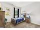 bedroom with dinosaur-themed decor and a wooden bed at 10462 Trellis Lane (Lot 41), Hampton, GA 30228