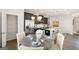 Kitchen features a casual dining area with a round table and chairs at 10462 Trellis Lane (Lot 41), Hampton, GA 30228