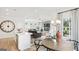 Open concept kitchen with island seating and a view into the living room at 10462 Trellis Lane (Lot 41), Hampton, GA 30228