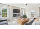 Cozy living room features a fireplace and built-in TV at 10462 Trellis Lane (Lot 41), Hampton, GA 30228