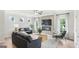 Spacious living room with fireplace, TV, and ample seating at 10462 Trellis Lane (Lot 41), Hampton, GA 30228