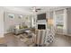 Spacious living room features a fireplace and large windows at 10462 Trellis Lane (Lot 41), Hampton, GA 30228