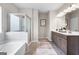 Bathroom boasts a large shower, soaking tub, and double vanity at 1480 Trellis Court (Lot 42), Hampton, GA 30228