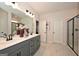 Elegant bathroom with double vanity and frameless shower at 1480 Trellis Court (Lot 42), Hampton, GA 30228