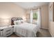 Charming bedroom with a comfortable bed and natural light at 1480 Trellis Court (Lot 42), Hampton, GA 30228
