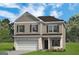 Two-story house with a neutral color scheme and a two-car garage at 1480 Trellis Court (Lot 42), Hampton, GA 30228