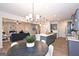 Open concept kitchen with breakfast bar and view to the living room at 1480 Trellis Court (Lot 42), Hampton, GA 30228
