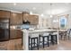 Modern kitchen with island, stainless steel appliances, and ample cabinet space at 1480 Trellis Court (Lot 42), Hampton, GA 30228
