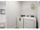 Convenient laundry room with washer, dryer, and shelving at 1480 Trellis Court (Lot 42), Hampton, GA 30228