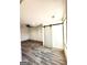Spacious basement room, featuring vinyl flooring and barn door at 1279 Allene Sw Ave, Atlanta, GA 30310