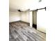 Finished basement area with vinyl flooring and ceiling fan at 1279 Allene Sw Ave, Atlanta, GA 30310