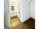 Clean bathroom with white vanity and wood-look floors at 1279 Allene Sw Ave, Atlanta, GA 30310