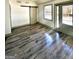 Versatile bonus room with grey vinyl plank flooring and barn door at 1279 Allene Sw Ave, Atlanta, GA 30310
