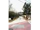 Community features a paved pathway with trees and seating at 1279 Allene Sw Ave, Atlanta, GA 30310