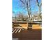 Wooden deck with railing offering a view of the backyard and trees at 1279 Allene Sw Ave, Atlanta, GA 30310