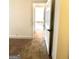 Bright hallway with wood-look floors and access to bedrooms at 1279 Allene Sw Ave, Atlanta, GA 30310