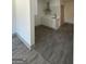 Modern kitchen with white cabinets and wood-look floors at 1279 Allene Sw Ave, Atlanta, GA 30310