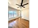 Bright living room with hardwood floors, ceiling fan, and large window at 1279 Allene Sw Ave, Atlanta, GA 30310