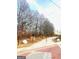 Paved pathway winds through a tree-lined area, offering a tranquil outdoor space at 1279 Allene Sw Ave, Atlanta, GA 30310