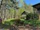 Wooded backyard with shed and landscaping at 500 Augusta Ln, Chattahoochee Hills, GA 30268