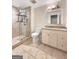 Updated bathroom with a walk-in shower and granite vanity at 500 Augusta Ln, Chattahoochee Hills, GA 30268