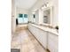 Large bathroom with double vanity and soaking tub at 500 Augusta Ln, Chattahoochee Hills, GA 30268