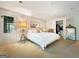 Bright bedroom featuring a king-size bed and private access at 500 Augusta Ln, Chattahoochee Hills, GA 30268