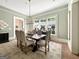 Formal dining room with chandelier and large windows at 500 Augusta Ln, Chattahoochee Hills, GA 30268