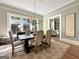 Formal dining room with a view to the living area at 500 Augusta Ln, Chattahoochee Hills, GA 30268